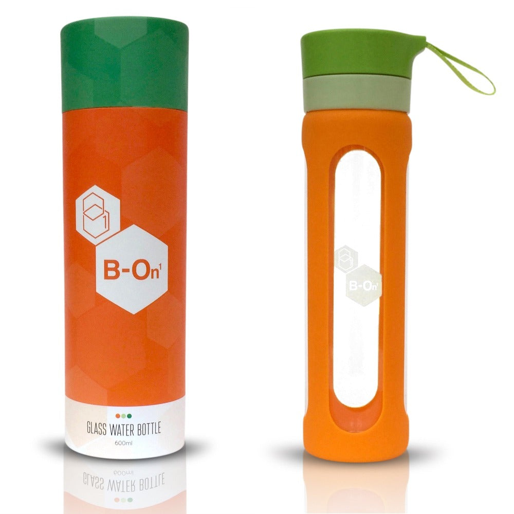orange and green b on 1 glass water bottle